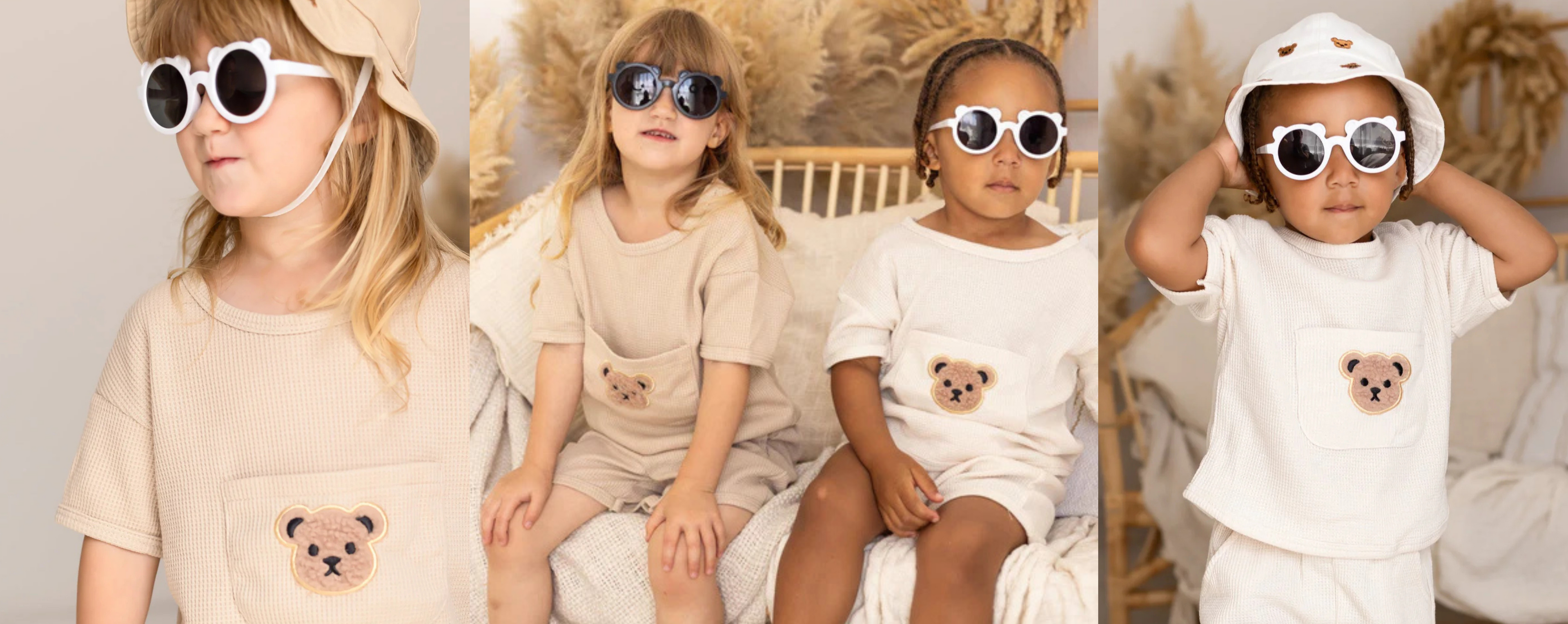 Four children wearing matching outfits with teddy bear designs and sunglasses.